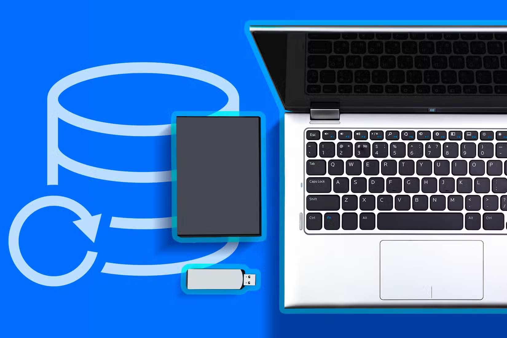 a-laptop-with-a-usb-drive-and-an-external-hard-drive-next-to-it-and-a-backup-icon-1 تجنب هذه الأخطاء الشائعة عند تنظيف الكمبيوتر الشخصي لتحسين أدائه