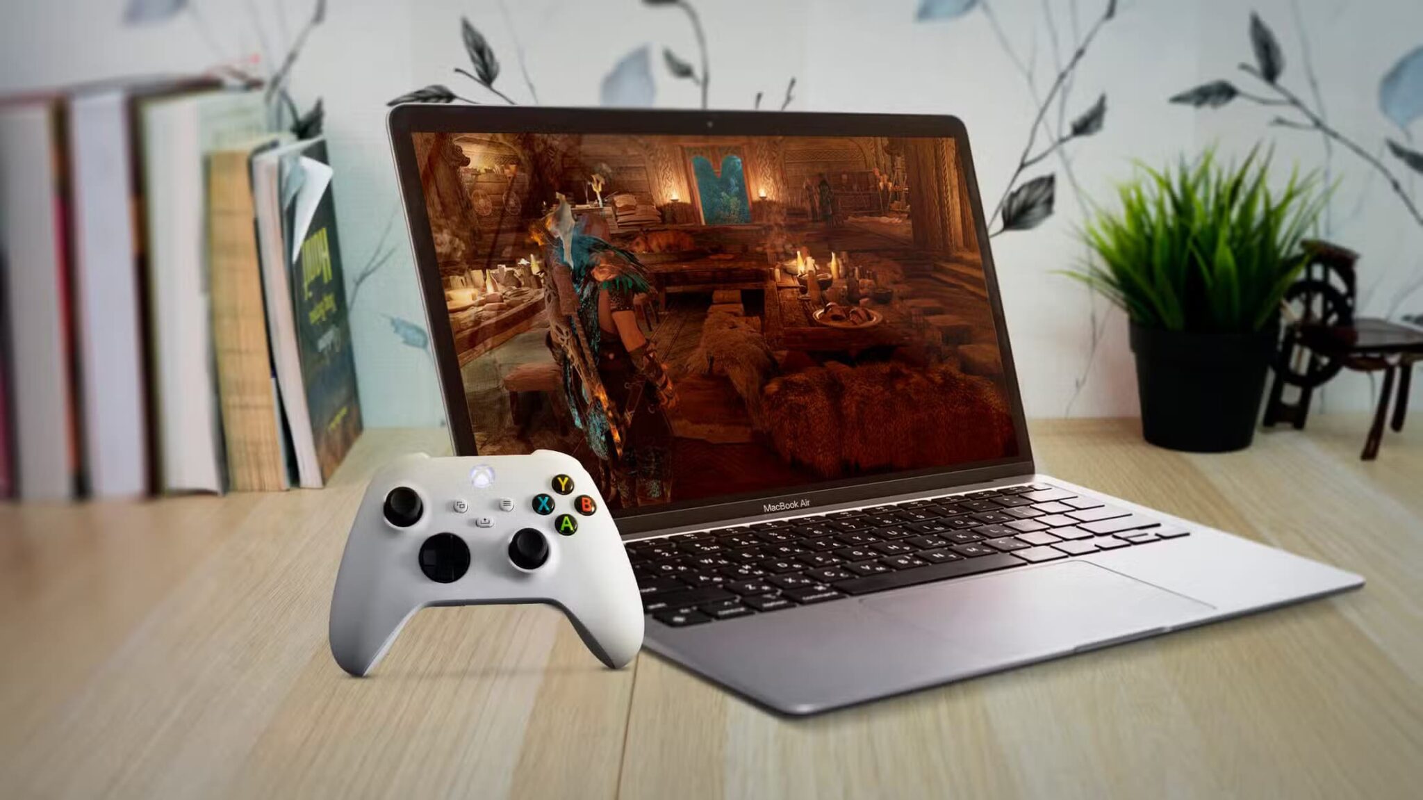 a-macbook-air-under-a-wooden-table-with-a-game-on-the-screen-and-an-xbox-controller-on-the-left-scaled هل يمكن لأجهزة Mac أن تصبح خيارًا عمليًا للاعبين بعام 2025؟