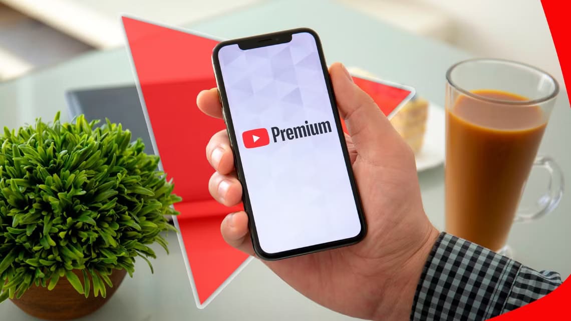 a-hand-holding-a-phone-with-youtube-premium-logo-on-the-screen مشاهدة فيديوهات يوتيوب بدون إعلانات بأسعار معقولة مع YouTube Premium Lite